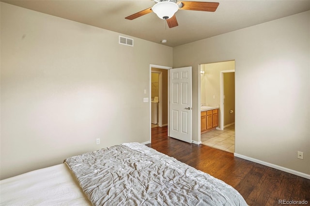 15594 E 97th Ave, Commerce City, CO 80022 - bedroom with ensuite bath, a ceiling fan, baseboards, wood finished floors, and visible vents