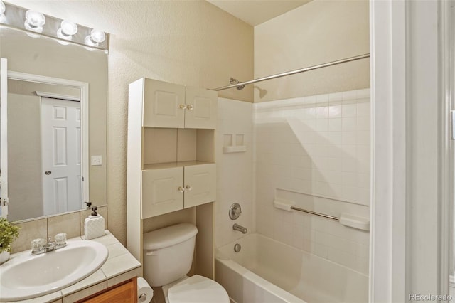 15594 E 97th Ave, Commerce City, CO 80022 - full bath featuring shower / bath combination, vanity, a textured wall, and toilet