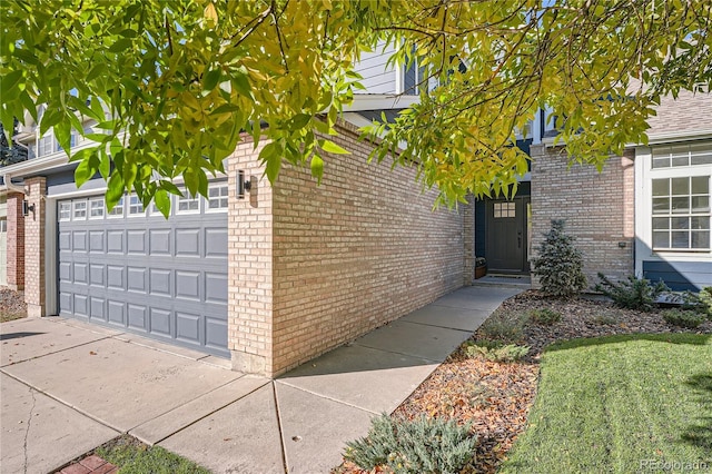 view of side of home featuring a garage