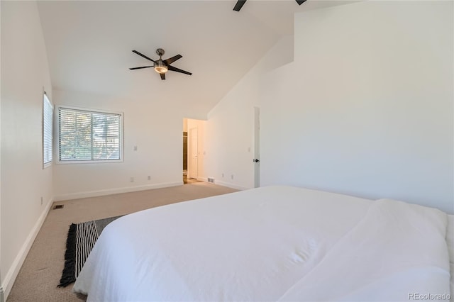 bedroom with light carpet, ceiling fan, and vaulted ceiling