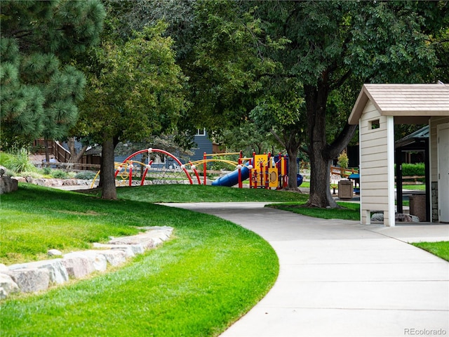 view of community featuring a lawn and a playground