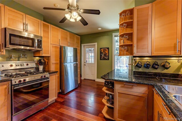 kitchen featuring open shelves, baseboards, ceiling fan, dark wood-style floors, and stainless steel appliances