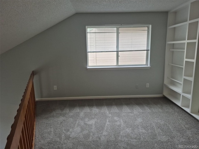 2238 S Nile Ct, Aurora, CO 80014 - bonus room with carpet, a textured ceiling, vaulted ceiling, and baseboards