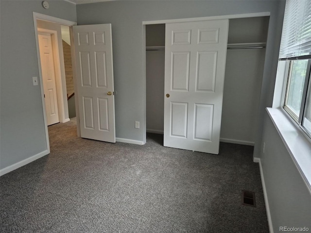 2238 S Nile Ct, Aurora, CO 80014 - unfurnished bedroom with a closet, carpet flooring, and baseboards