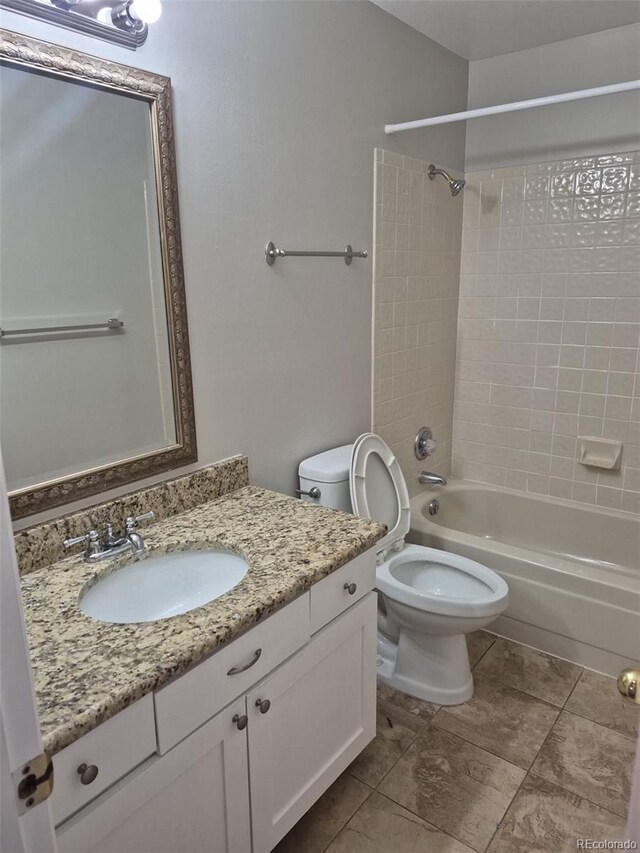 2238 S Nile Ct, Aurora, CO 80014 - bathroom with shower / bathtub combination, vanity, toilet, and tile patterned flooring