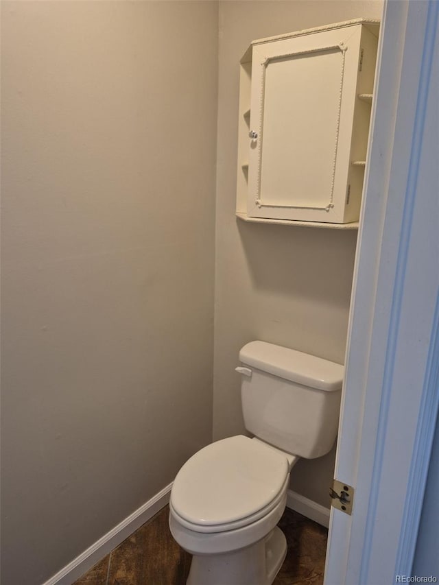 2238 S Nile Ct, Aurora, CO 80014 - bathroom featuring baseboards and toilet