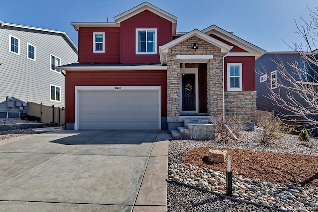 4840 Point Mesa St, Castle Rock, CO 80108 - view of front of house featuring stone siding, concrete driveway, and an attached garage