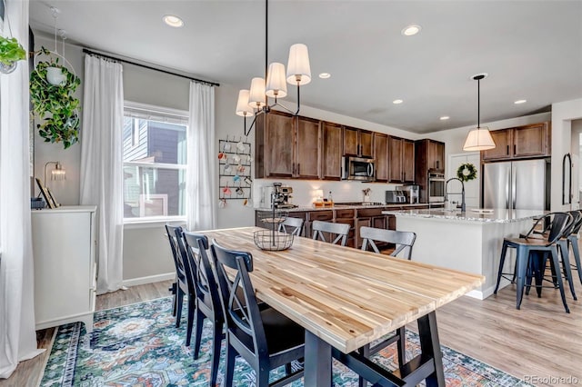 4840 Point Mesa St, Castle Rock, CO 80108 - dining space with recessed lighting, light wood-style flooring, and baseboards