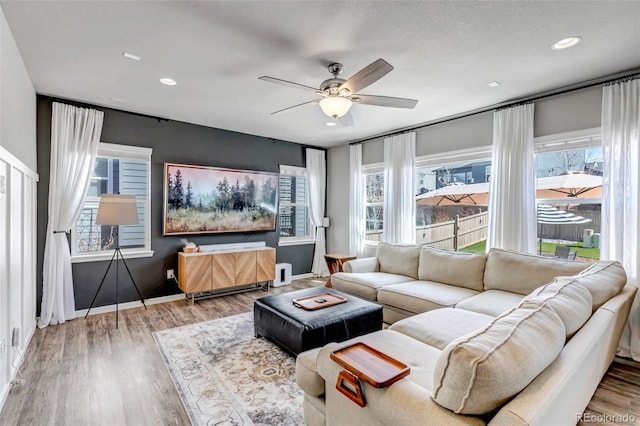 4840 Point Mesa St, Castle Rock, CO 80108 - living area featuring ceiling fan, wood finished floors, baseboards, and recessed lighting