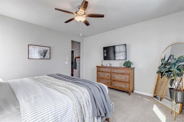 4840 Point Mesa St, Castle Rock, CO 80108 - bedroom with light colored carpet, a ceiling fan, and baseboards