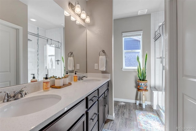 4840 Point Mesa St, Castle Rock, CO 80108 - full bath with a stall shower, double vanity, wood finished floors, and baseboards