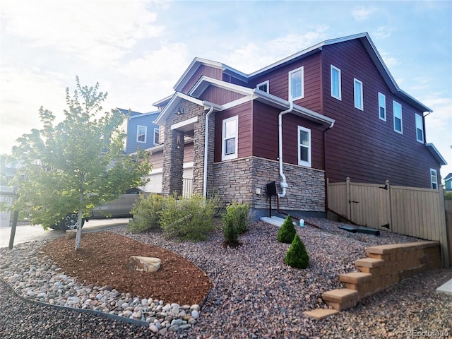4840 Point Mesa St, Castle Rock, CO 80108 - view of side of property featuring stone siding and a garage