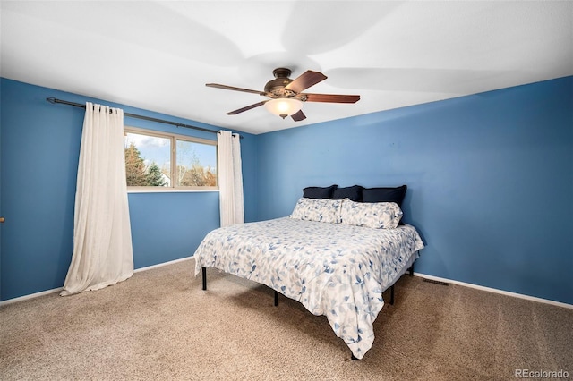 carpeted bedroom featuring ceiling fan