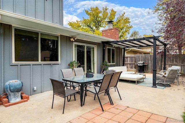 view of patio / terrace with a pergola and grilling area