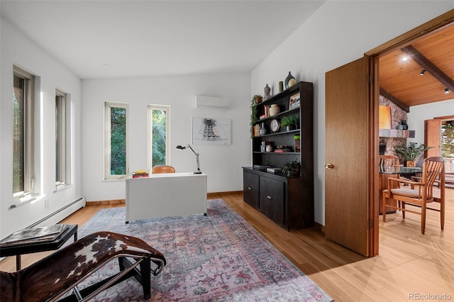 3 Twilight Dr, Wheat Ridge, CO 80215 - office area with a wall unit AC, light wood finished floors, and a baseboard radiator