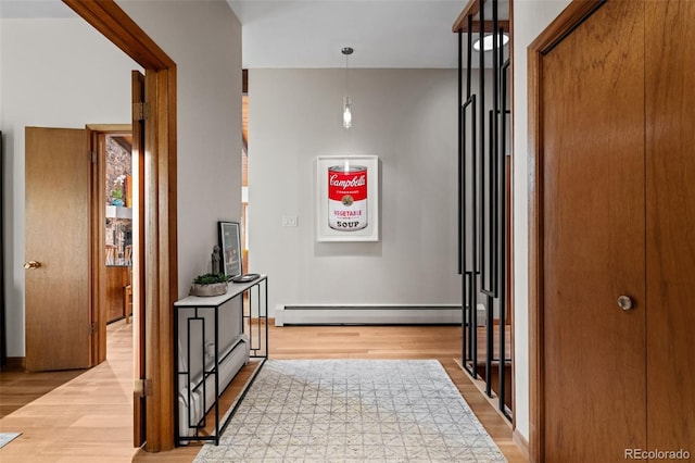 3 Twilight Dr, Wheat Ridge, CO 80215 - corridor with a baseboard heating unit and light wood finished floors
