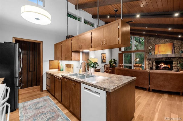 3 Twilight Dr, Wheat Ridge, CO 80215 - kitchen with dishwasher, freestanding refrigerator, range, light wood-style flooring, and a wood ceiling with exposed beams