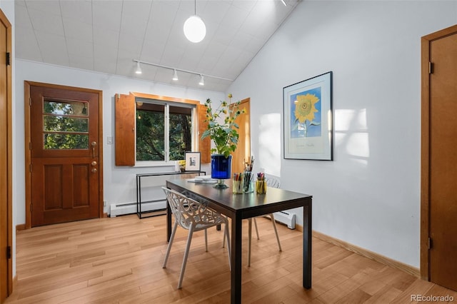 3 Twilight Dr, Wheat Ridge, CO 80215 - dining space featuring light wood-style floors, baseboard heating, track lighting, an office area, and vaulted ceiling