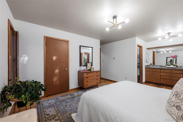 3 Twilight Dr, Wheat Ridge, CO 80215 - bedroom with a chandelier and light wood finished floors