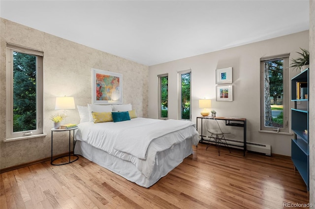 3 Twilight Dr, Wheat Ridge, CO 80215 - bedroom with baseboard heating and wood finished floors