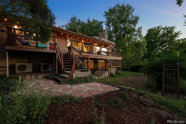 3 Twilight Dr, Wheat Ridge, CO 80215 - back of property featuring a chimney, stairs, and a deck