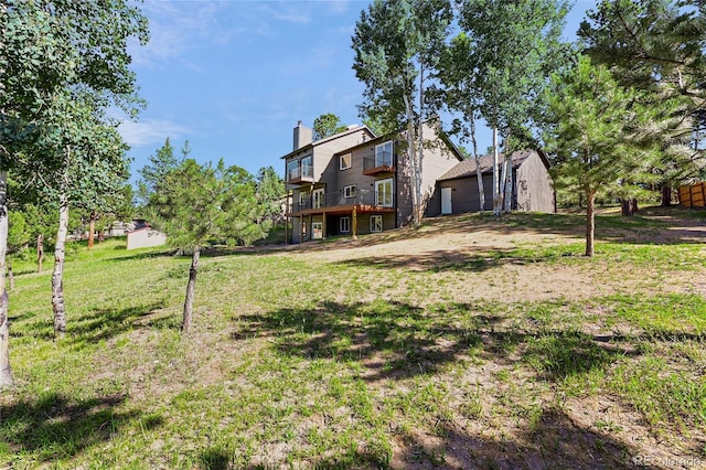 2289 Hiwan Dr, Evergreen, CO 80439 - view of green lawn featuring a deck