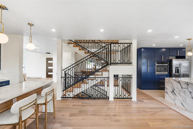 2289 Hiwan Dr, Evergreen, CO 80439 - dining space featuring light wood finished floors, recessed lighting, and stairs