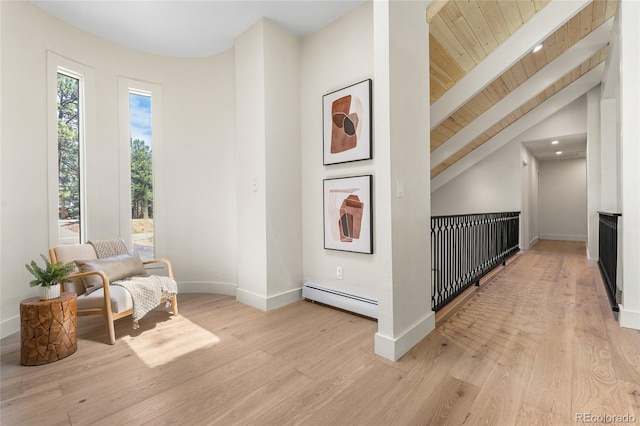 2289 Hiwan Dr, Evergreen, CO 80439 - sitting room featuring a baseboard radiator, light wood-style floors, and wooden ceiling