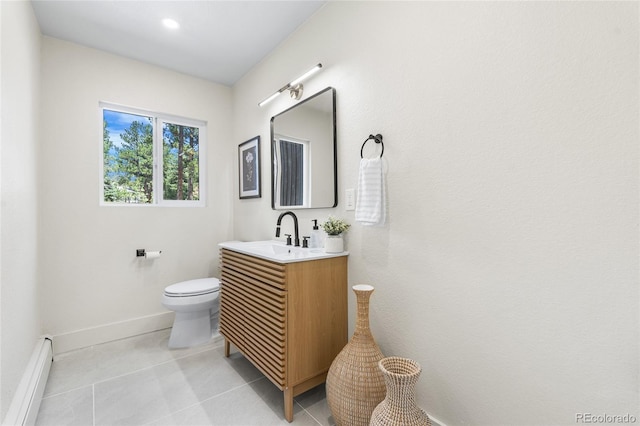 2289 Hiwan Dr, Evergreen, CO 80439 - bathroom featuring a baseboard heating unit, vanity, and tile patterned floors
