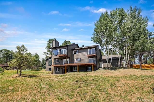 2289 Hiwan Dr, Evergreen, CO 80439 - back of house with a chimney and a wooden deck