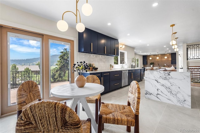 2289 Hiwan Dr, Evergreen, CO 80439 - kitchen with stainless steel dishwasher, decorative backsplash, recessed lighting, pendant lighting, and light tile patterned floors