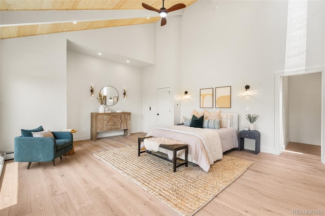 2289 Hiwan Dr, Evergreen, CO 80439 - bedroom with high vaulted ceiling, light wood-style floors, and a wood ceiling with exposed beams