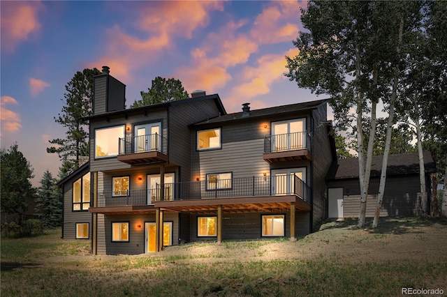 2289 Hiwan Dr, Evergreen, CO 80439 - rear view of property with a balcony, a chimney, and french doors