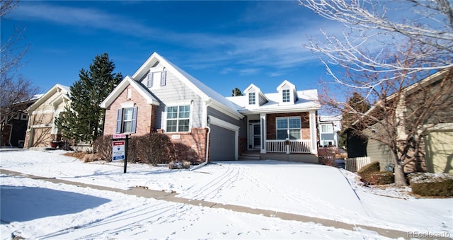 view of front of property featuring a garage and covered porch