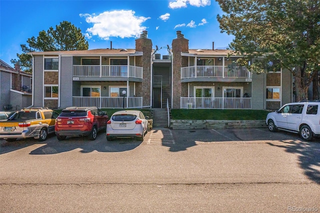 view of property featuring uncovered parking