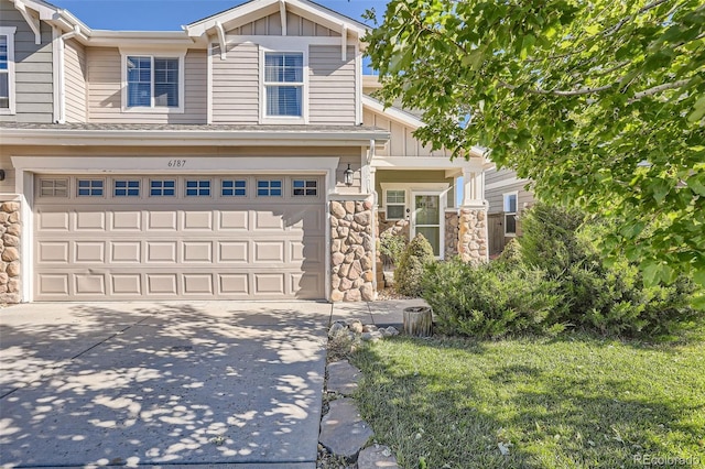 6187 Wescroft Ave, Castle Rock, CO 80104 - view of front of home featuring board and batten siding, a garage, stone siding, and driveway