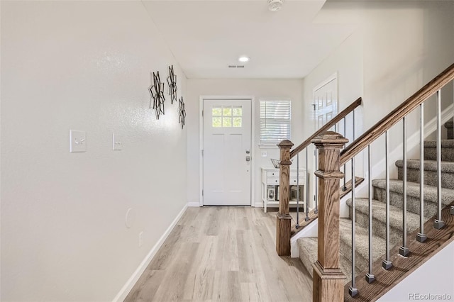 6187 Wescroft Ave, Castle Rock, CO 80104 - entryway with light wood-type flooring, baseboards, and stairs