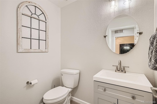 6187 Wescroft Ave, Castle Rock, CO 80104 - bathroom featuring toilet, vanity, and baseboards