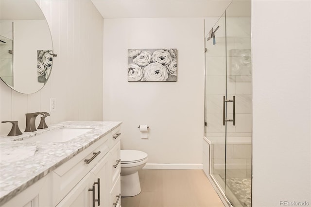 6187 Wescroft Ave, Castle Rock, CO 80104 - full bathroom with a shower stall, toilet, vanity, and baseboards