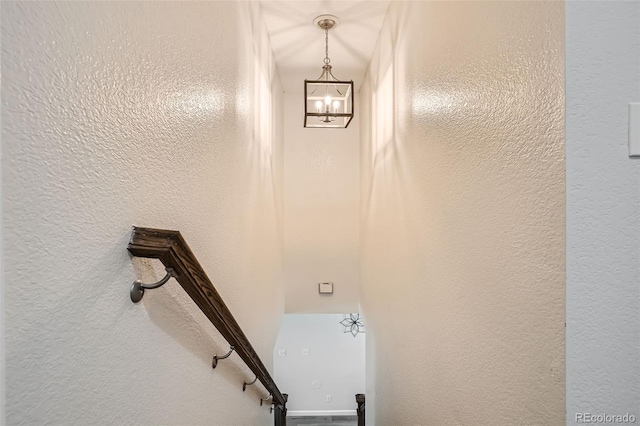 6187 Wescroft Ave, Castle Rock, CO 80104 - stairs with a chandelier and a textured wall