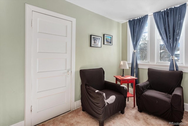 sitting room with light carpet