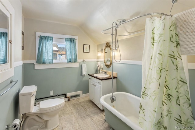 bathroom featuring vanity, lofted ceiling, and toilet