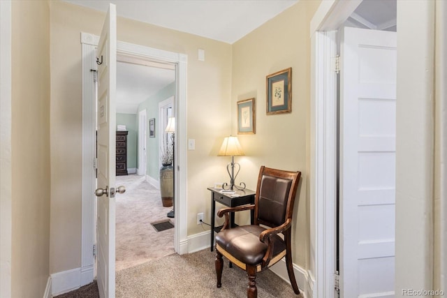 sitting room with light colored carpet