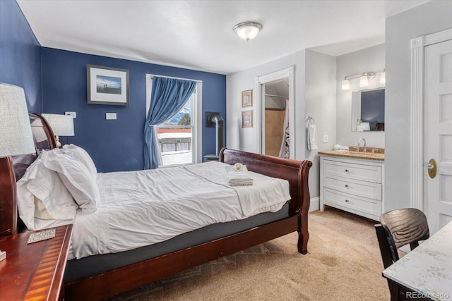 carpeted bedroom featuring sink