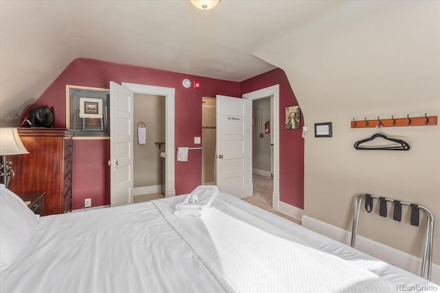 bedroom featuring lofted ceiling