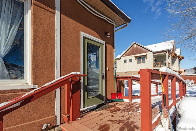 view of snow covered deck