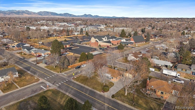 birds eye view of property featuring a mountain view