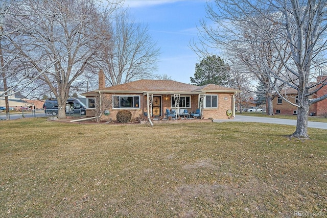 view of front of home featuring a front yard and a porch