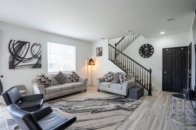 26985 E Bayaud Ave, Aurora, CO 80018 - living room featuring stairway and wood finished floors