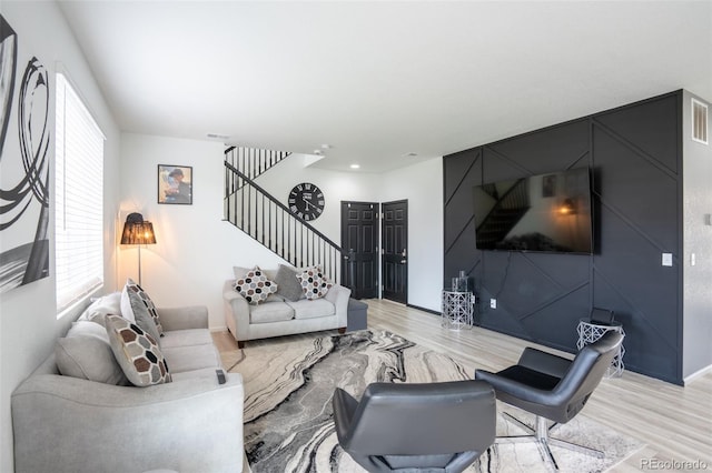 26985 E Bayaud Ave, Aurora, CO 80018 - living area with stairway and light wood finished floors